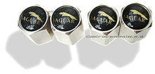 Load image into Gallery viewer, Tyre valve dust caps with gold Jaguar motif on black background (Set of 4) - CXB08201
